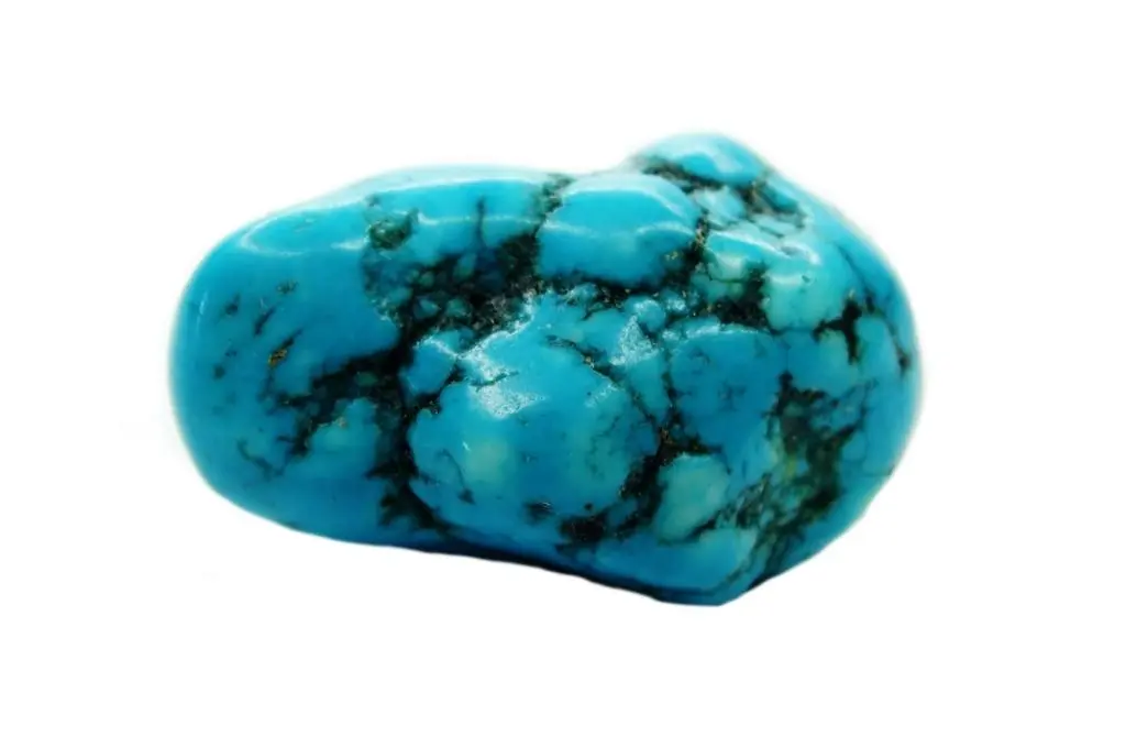 a piece of turquoise on a white background
