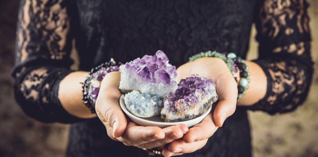 woman holding crystals in her hands