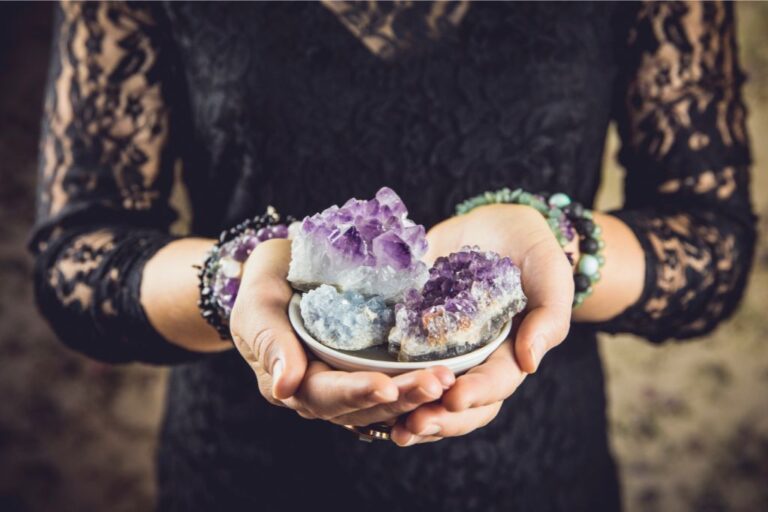 woman holding crystals in her hands