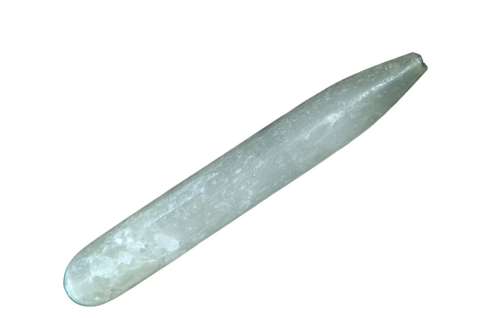 selenite wand on a white background