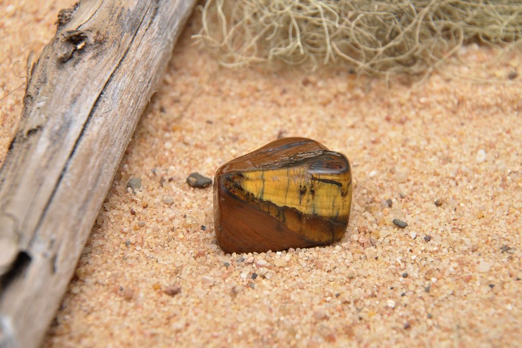 tiger's eye situated on sand
