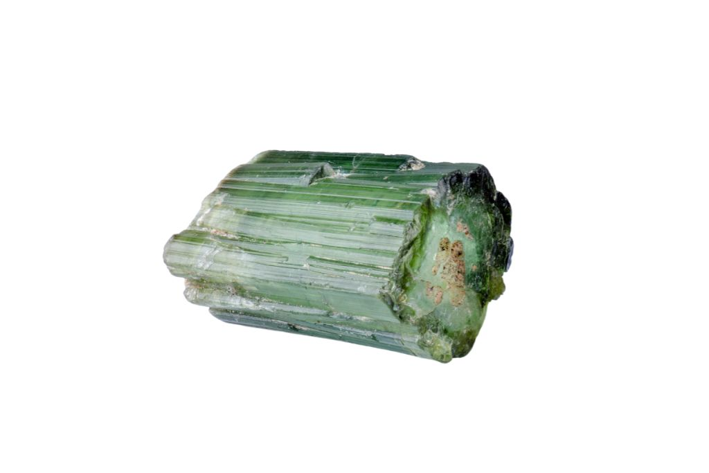 A green tourmaline on a white background