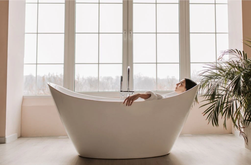 woman inside a white bathtub