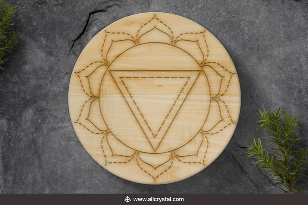 solar chakra crystal grid board on a marble background