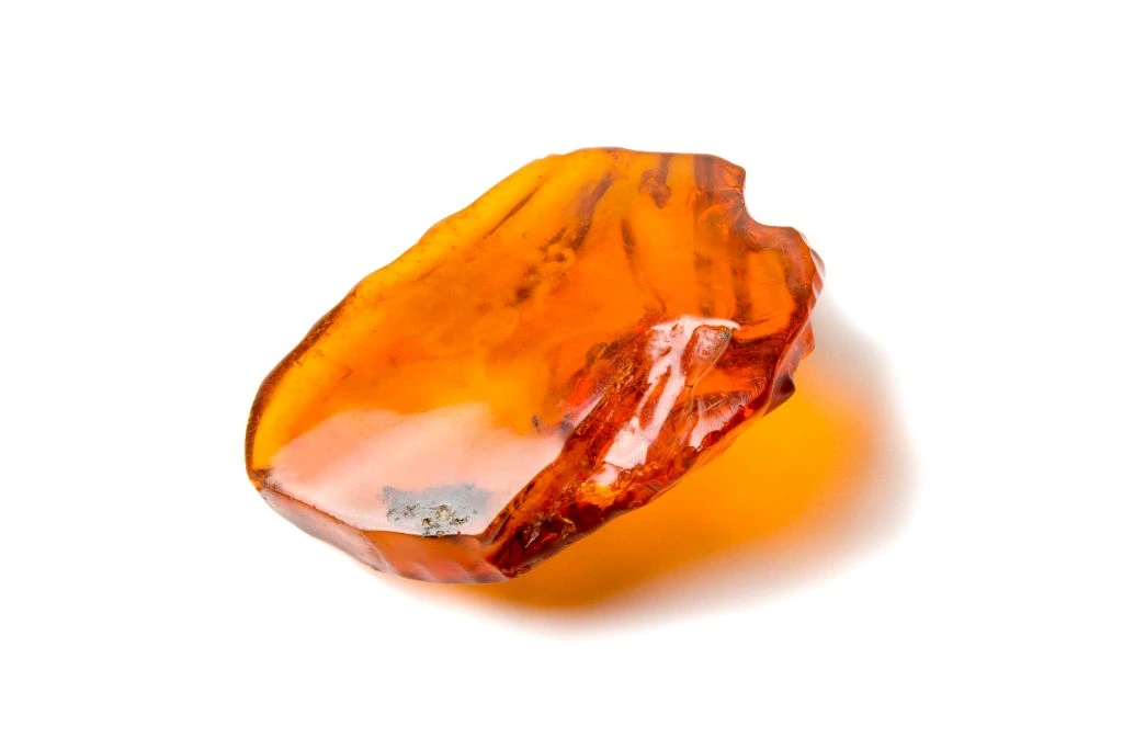 amber crystal on a white background