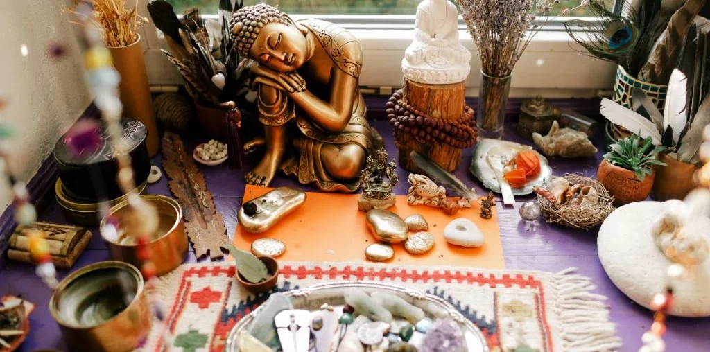 buddhist altar adorned with precious gemstones and singing bowls