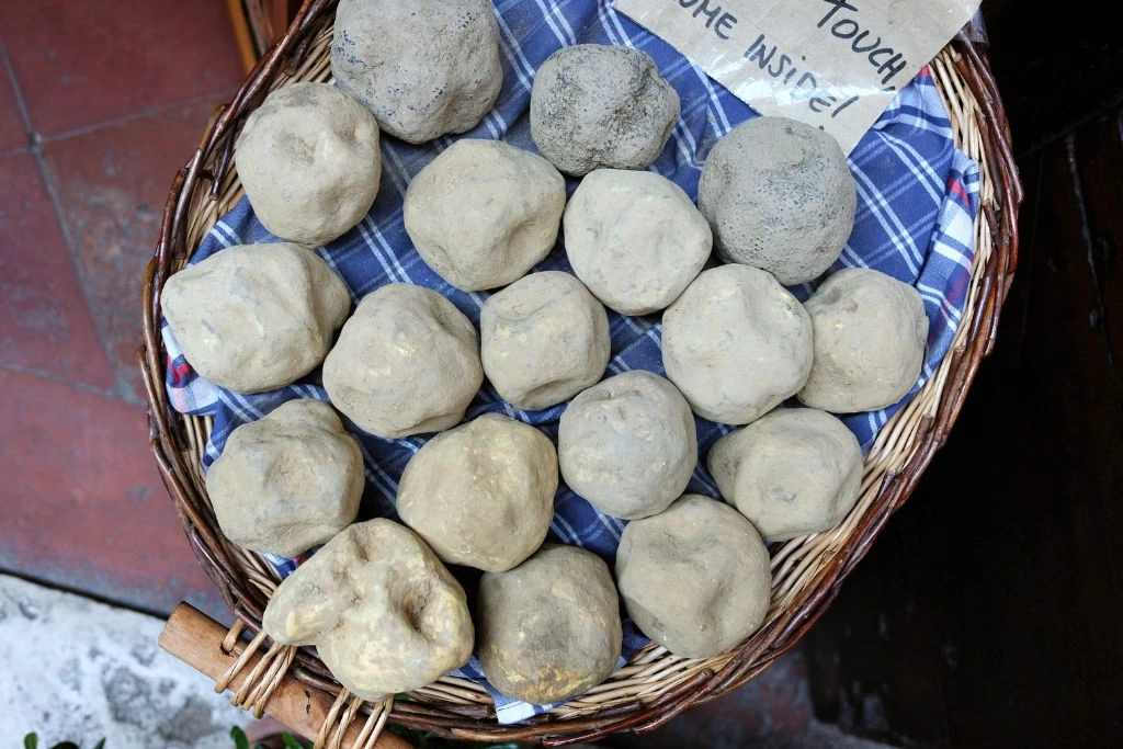 unopened geodes in a basket for sale
