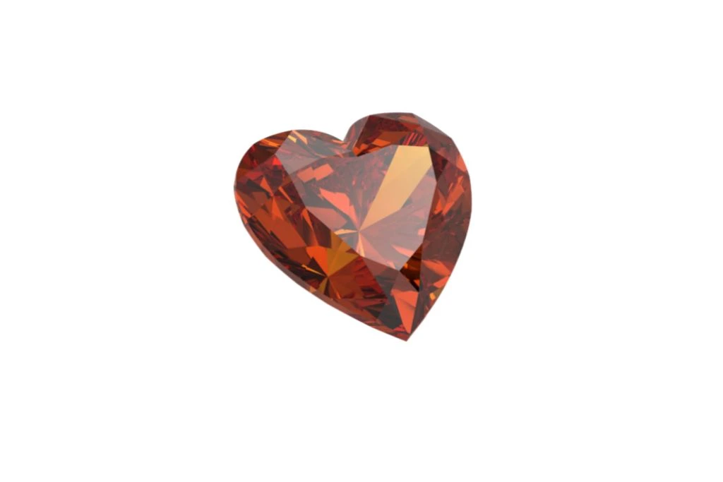 hessonite diamond cut in heart shape isolated on a white background