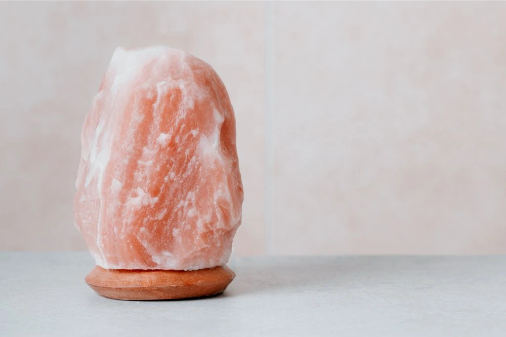 himalayan salt lamp on a neutral background