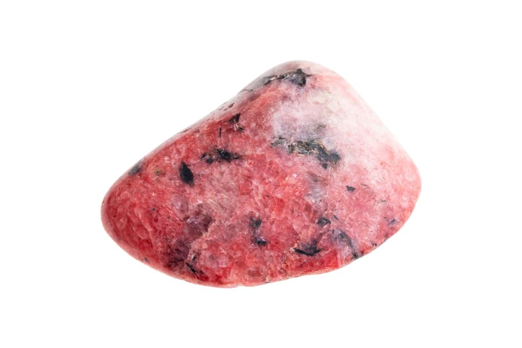 polished red agate stone on a white background