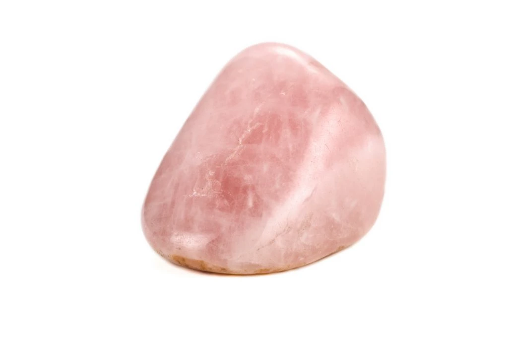 polished rose quartz on white background