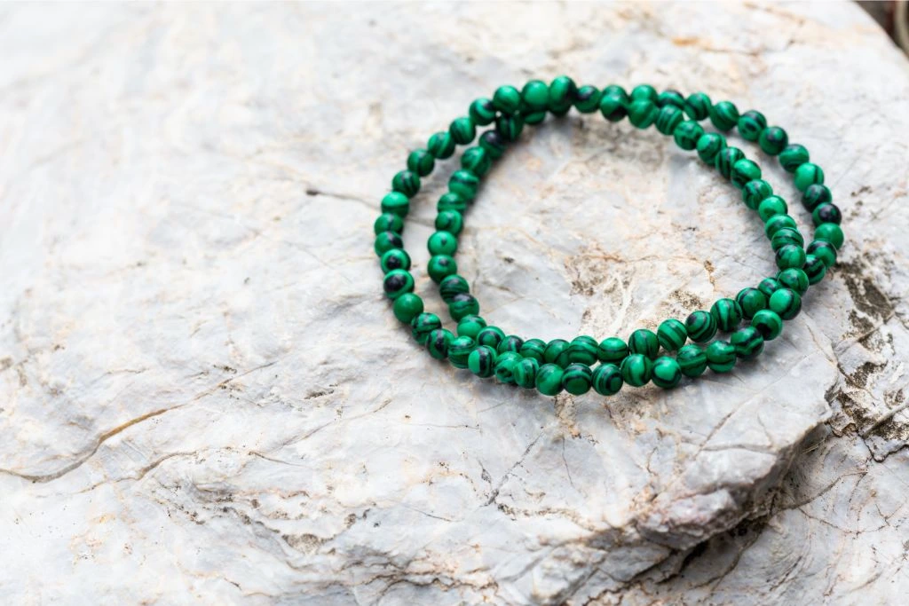 malachite bracelets on stone