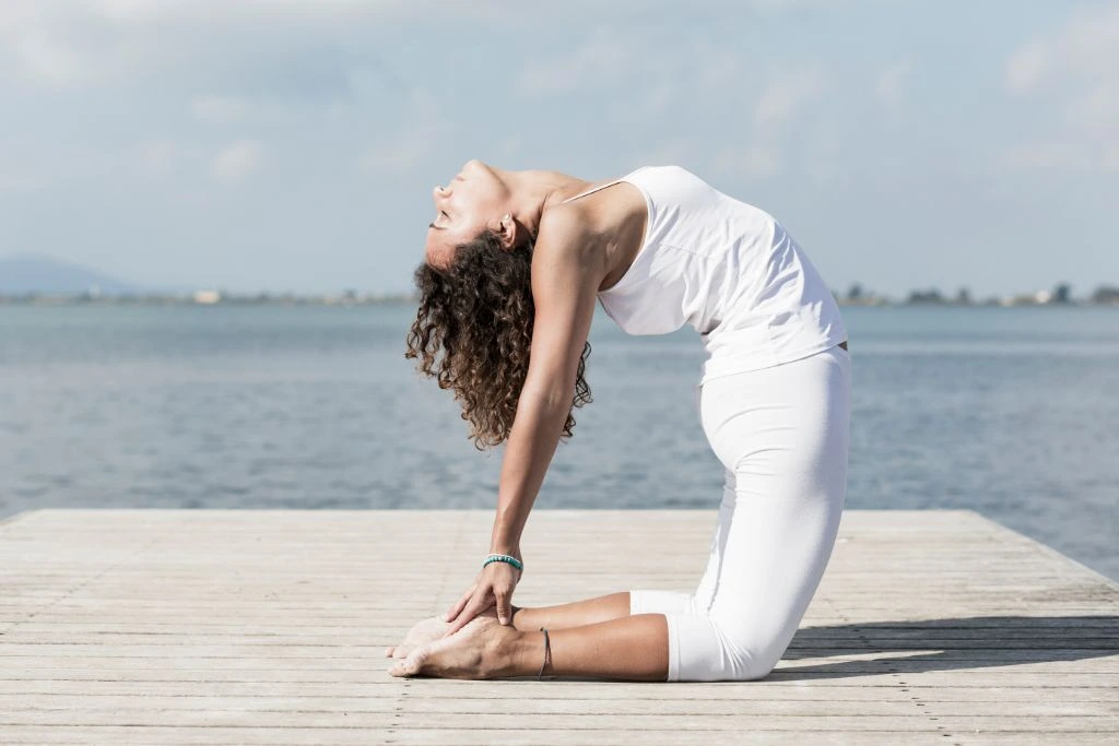 model doing yoga camel pose 