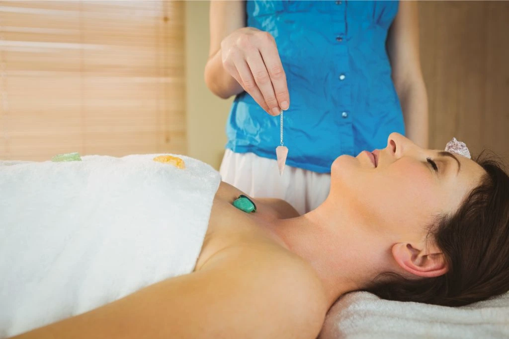 woman undergoing crystal healing