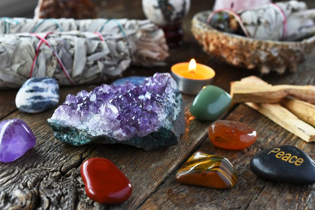 chakra crystal stones on a wooden table
