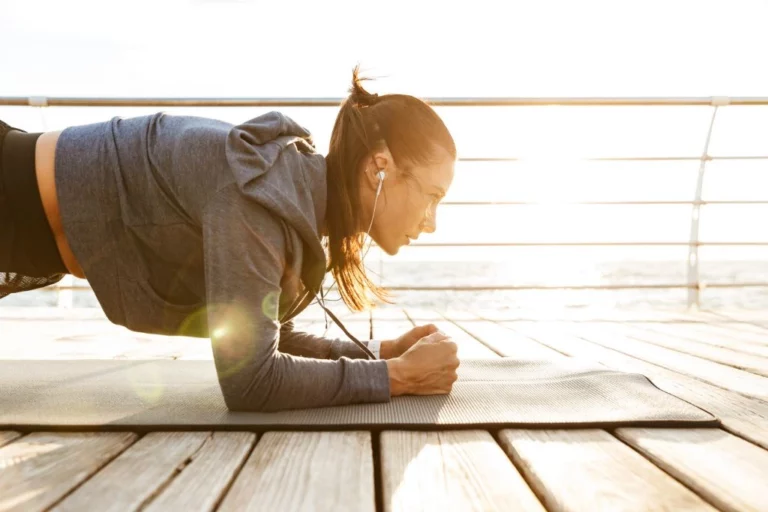 girl on yoga mat concentrating and focusing