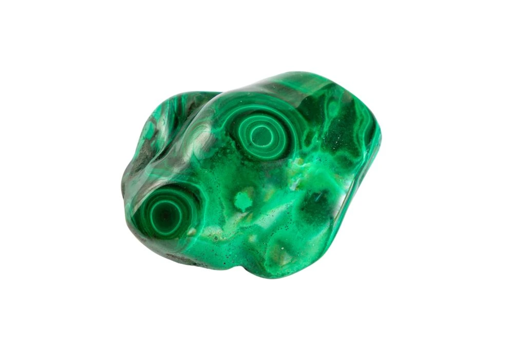 polished malachite on white background