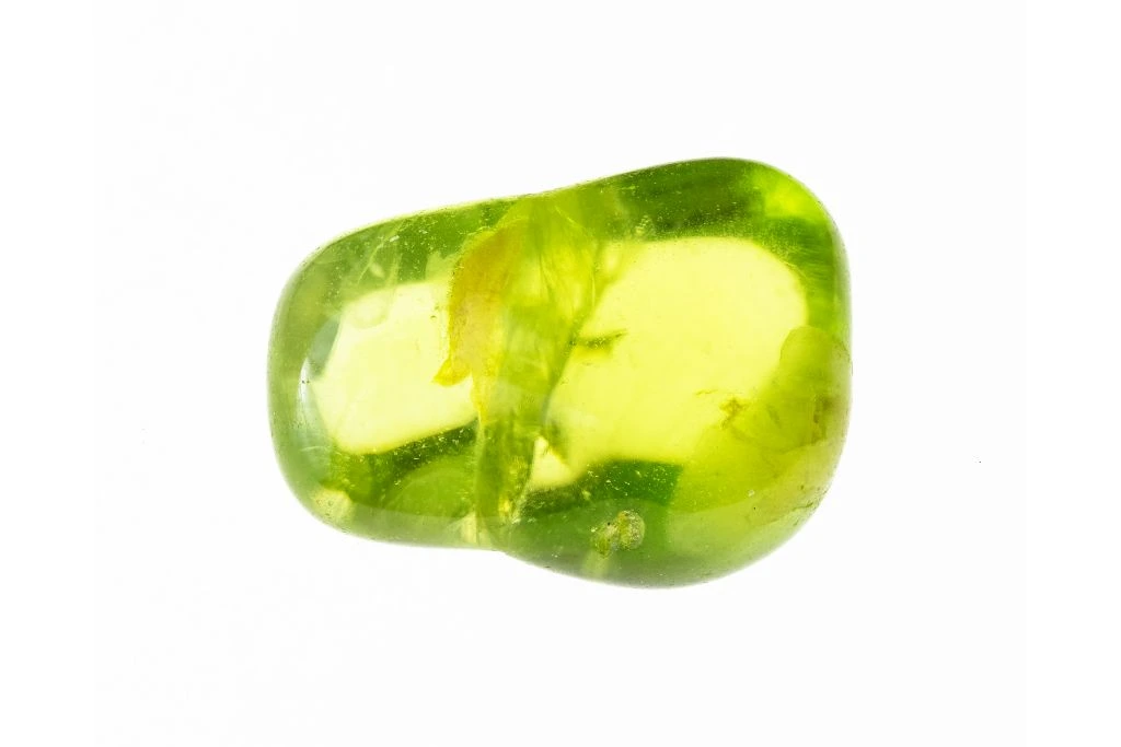 polished peridot on white background