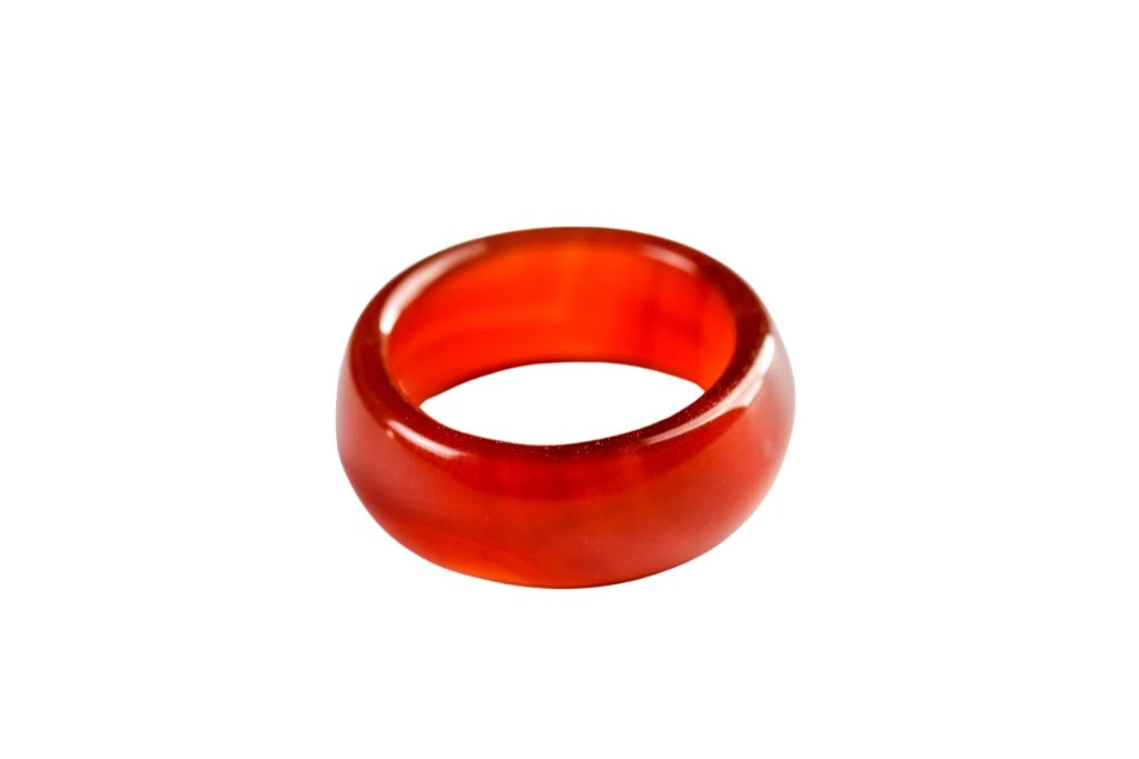 red jade ring on white background