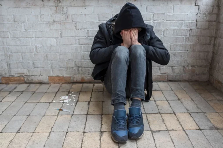 A man sitting on the floor