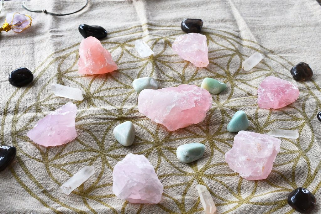 crystal grid cloth with rose quartz as the center crystal for love
