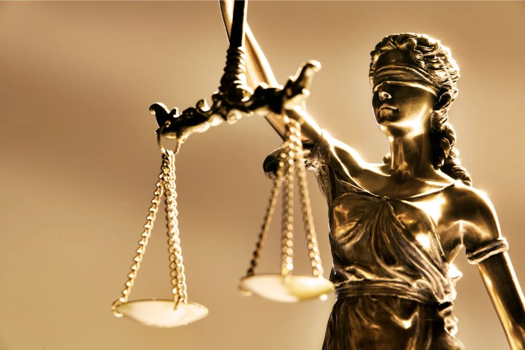 lady justice gold statue on gold background