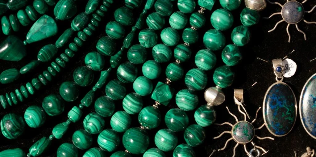 close up photo of malachite jewelry