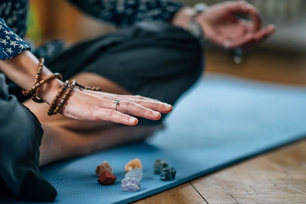 A person placing his hand on top of the crystals