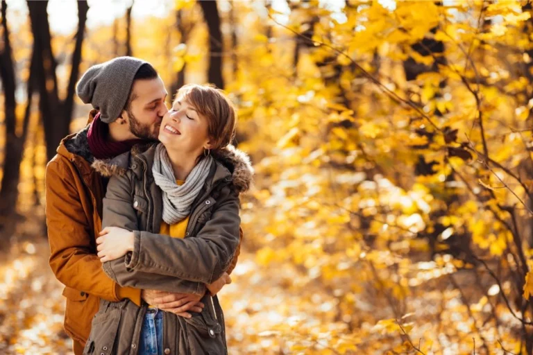 A man hugging a girl in nature