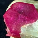 ruby crystal near with a clear crystal