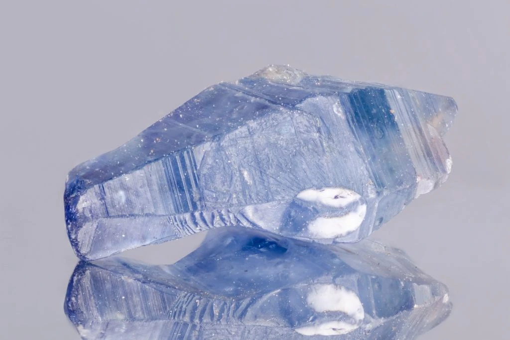 Sapphire crystal with a plain grayish background