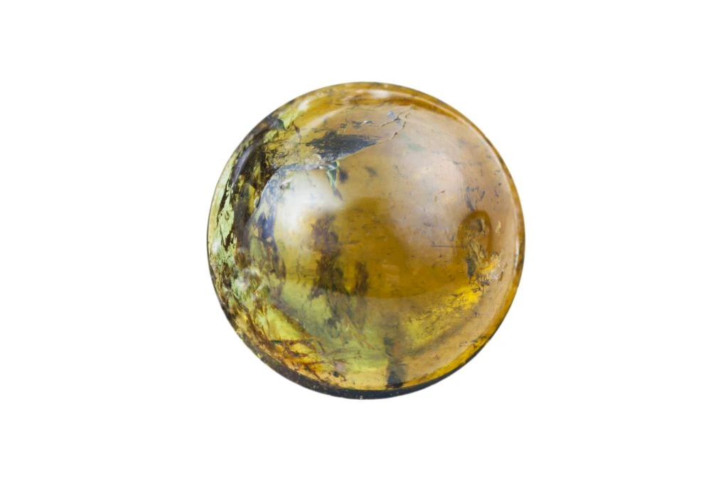 yellow tourmaline bead on white background