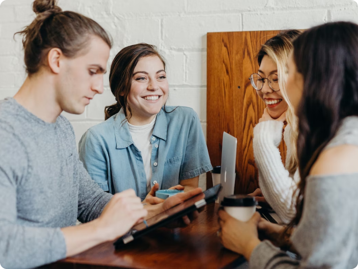 A group of people talking to each other