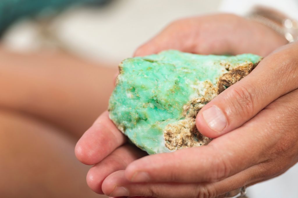 A person holding a Chrysoprase crystal