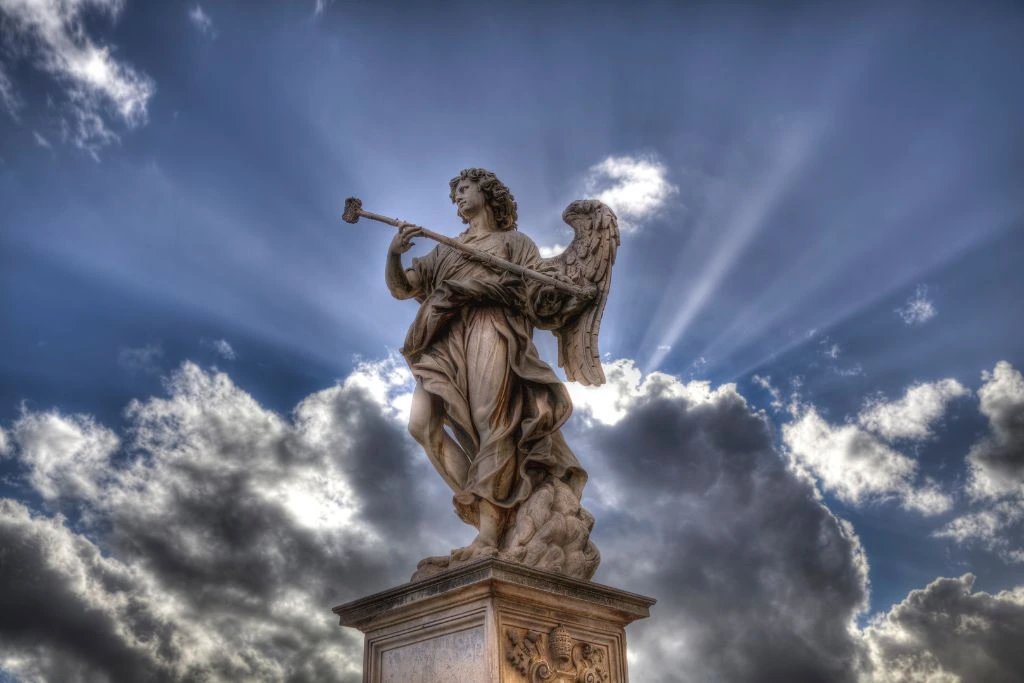 An Angel Statue on a pedestal