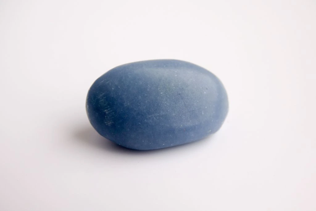 An angelite crystal on a beige background