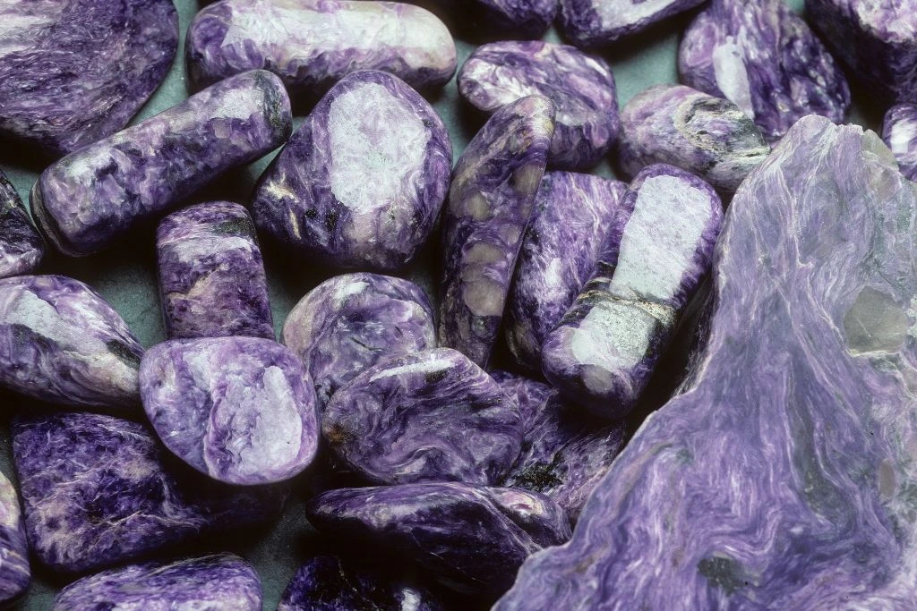 Raw charoite crystals