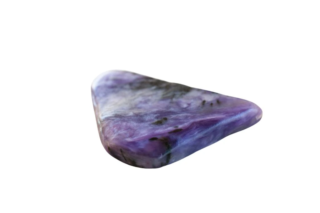 A Charoite on a white background
