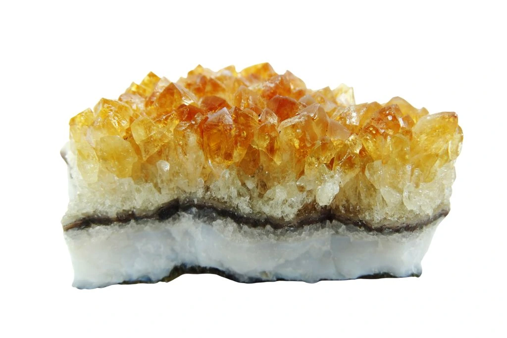 citrine geode rock on a white background