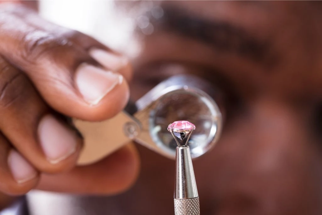 Jeweler Examining-Diamond Through a 
 Loupe