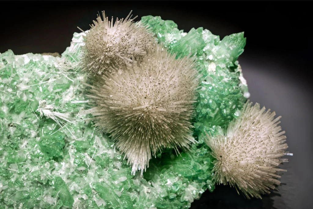 Mesolite on green fluorapophyllite crystals