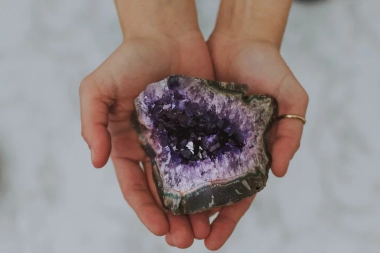 A person holding a geode with two hands