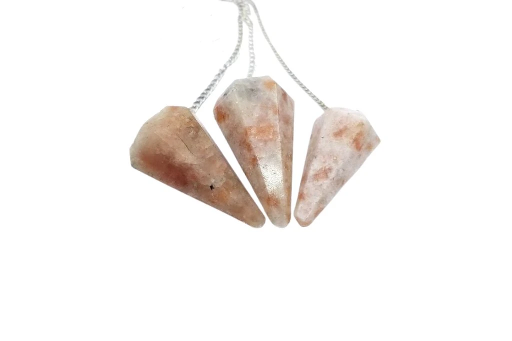 Three pieces of Sunstone Pendulum on a white background