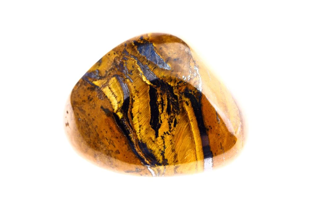 Tiger's eye Polished Gemstone on a white background