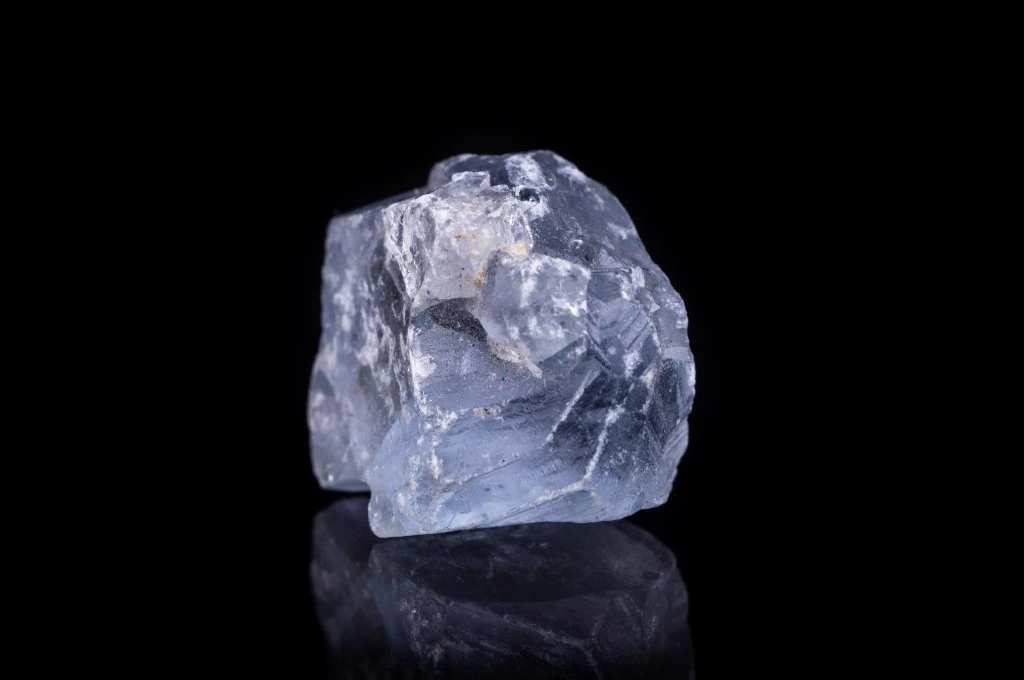 An angelite crystal on a dark background