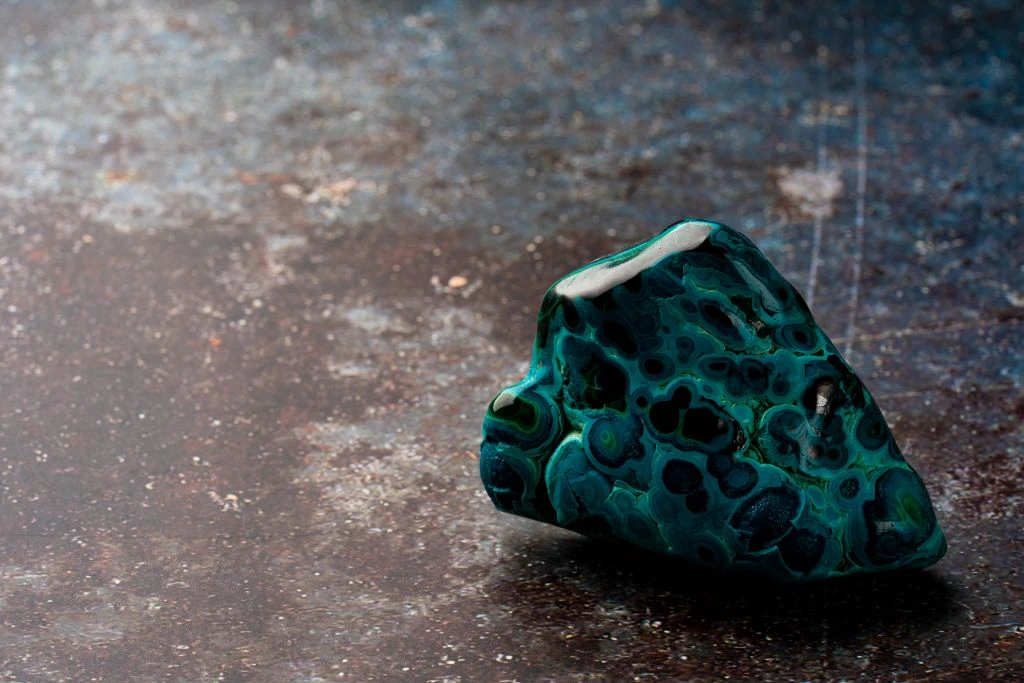 malachite on a stone counter top