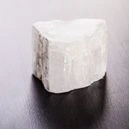 selenite chunk on wood table