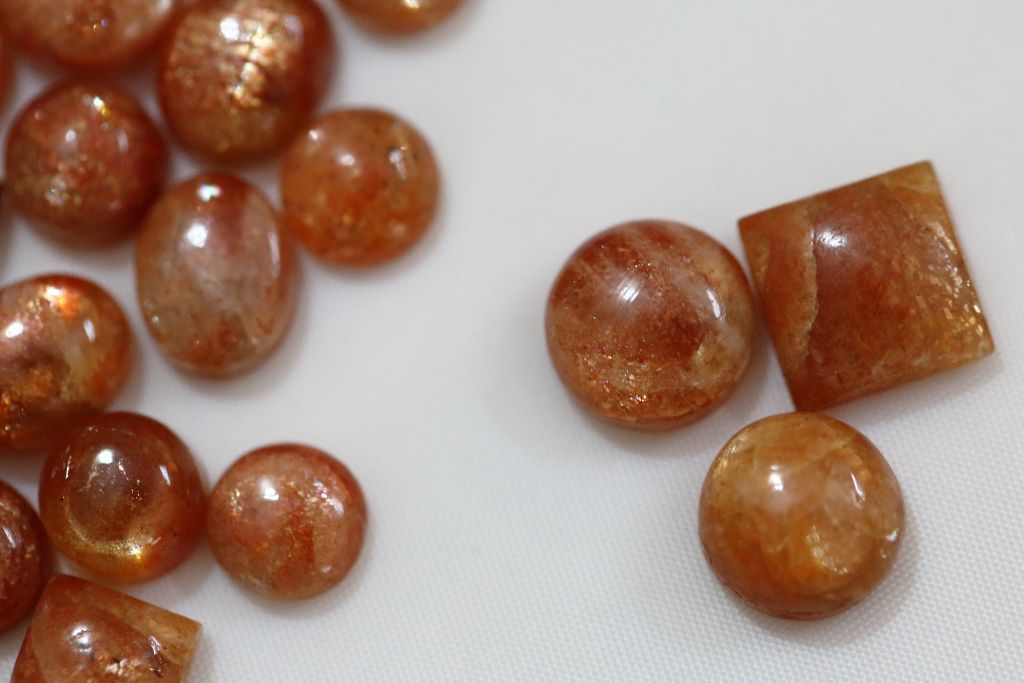 sunstone crystals on a white cloth