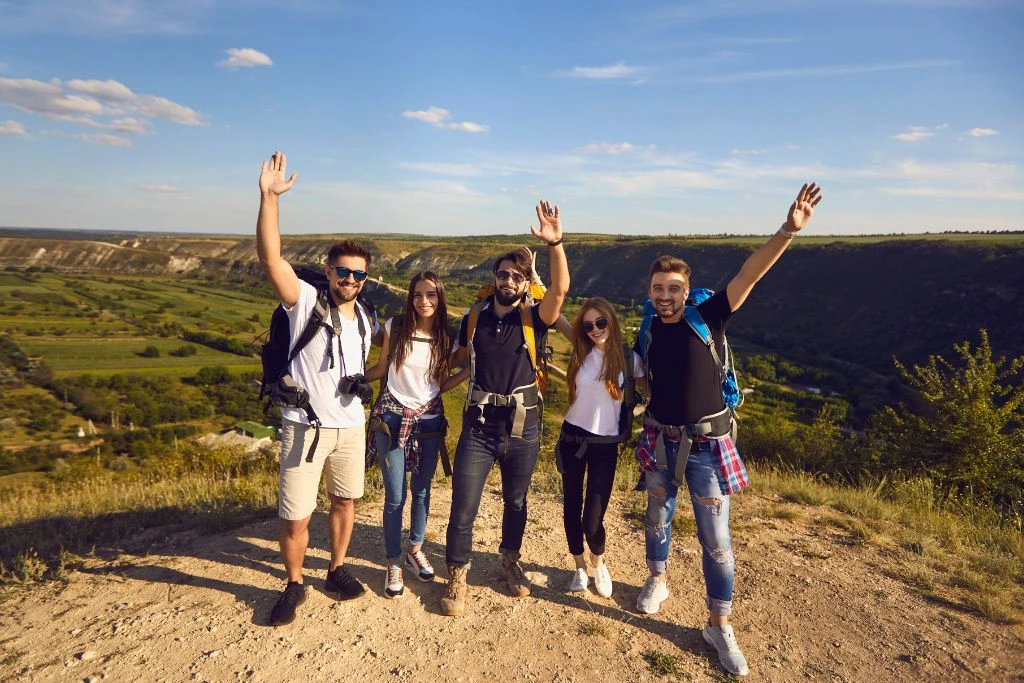 A group of people standing on a hill