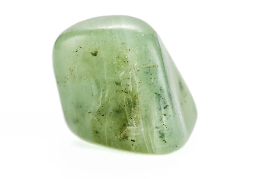 A polished jade on white background